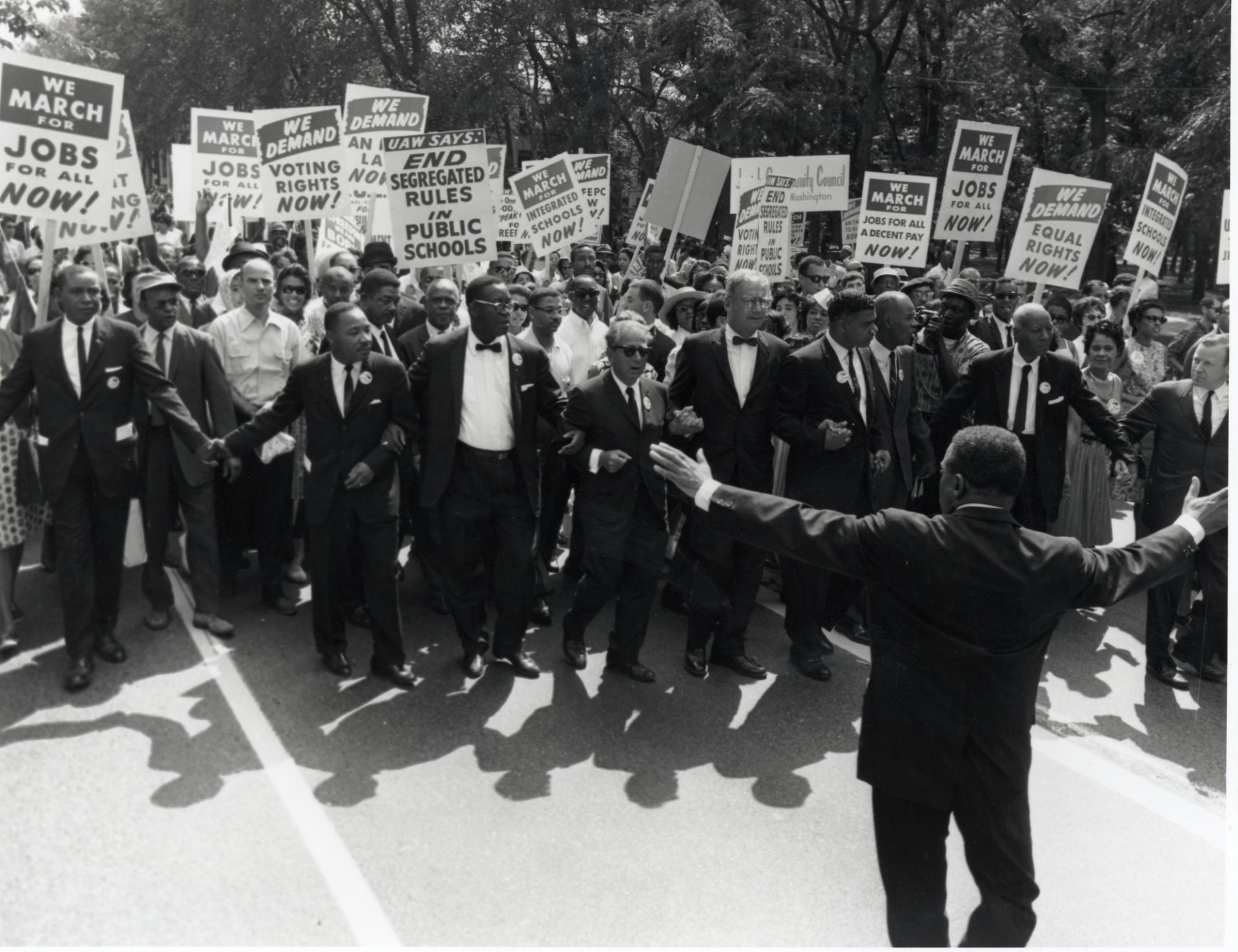 Anti-segregation march featuring Rev. Martin Luther King Jr., second first row from left. Source: Athena LeTrelle, on Flickr. CC BY-ND 2.0.