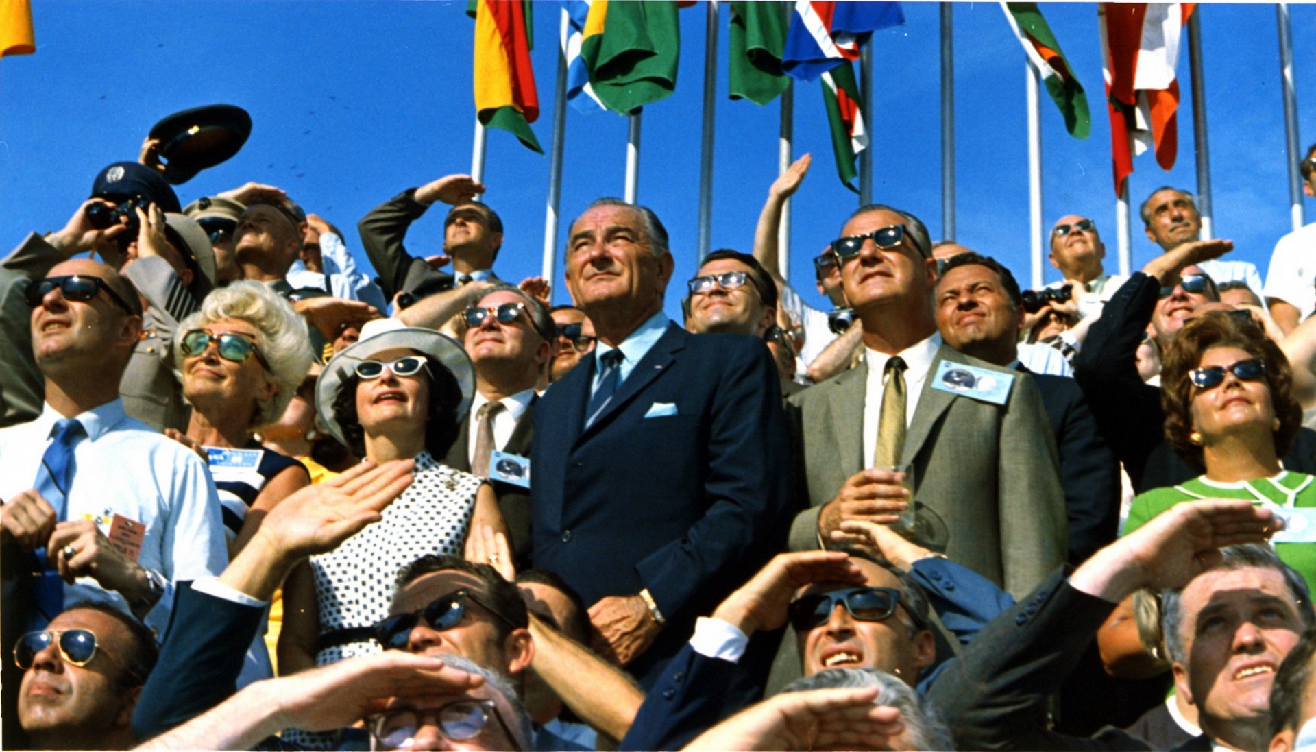 President Johnson and crowd watch return of Apollo 11