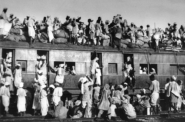 Overcrowded train transferring refugees during the partition of India, 1947. Source: Wikimedia Commons, Public domain.