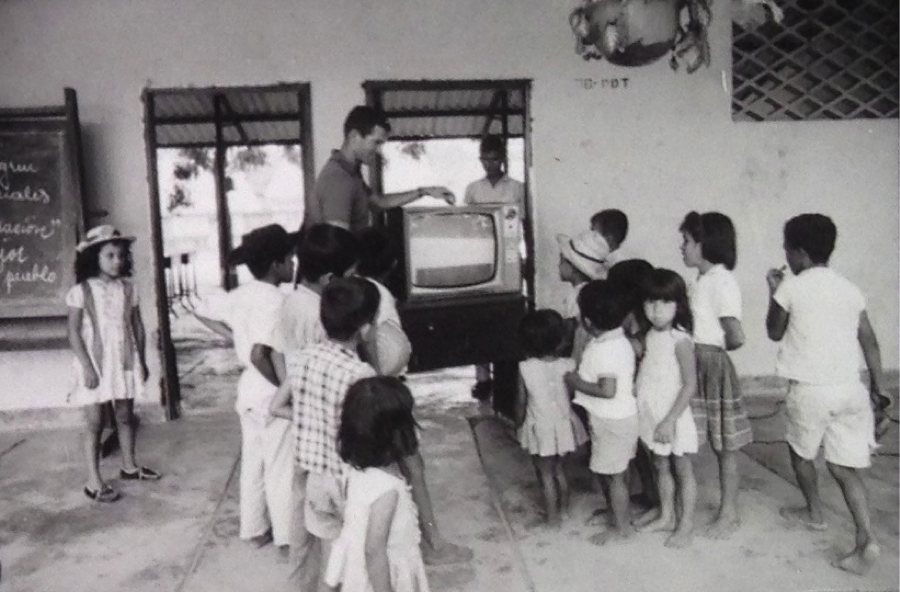 Peace Corps volunteer Dan Acuff installs a television receiver in the Escuela para Varones. El Espinal, Colombia, 1966. Source: National Archives and Record Administration, College Park, MD.