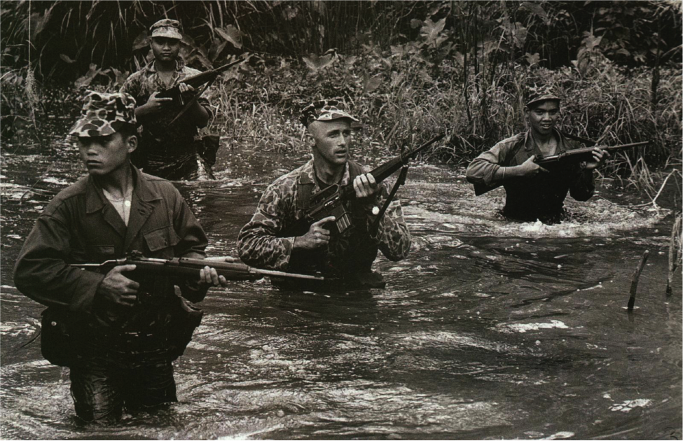Captain Vernon Gillespie and three unnamed Montagnard soldiers, Vietnam, 1964. Source: Life Magazine.