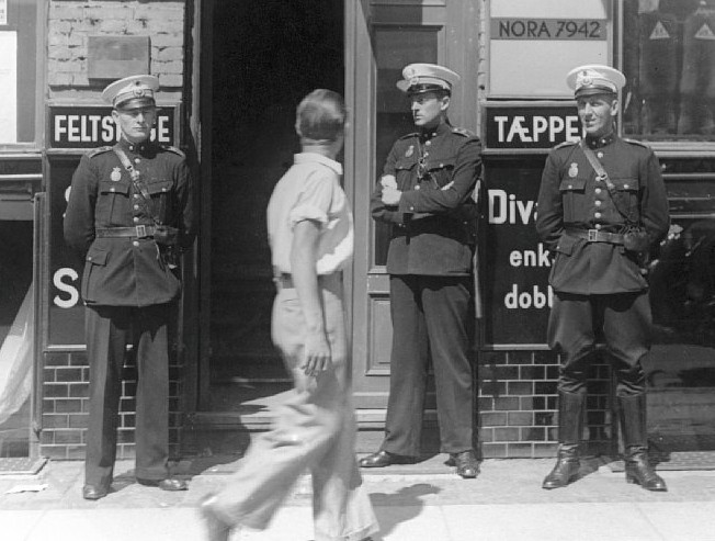 Police officers in front of Communist Party headquarters, Copenhagen 1941. Source: National Museum of Denmark. Flickr - No known copyright restrictions