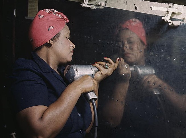Woman is working on a "Vengeance" dive bomber, 1944
