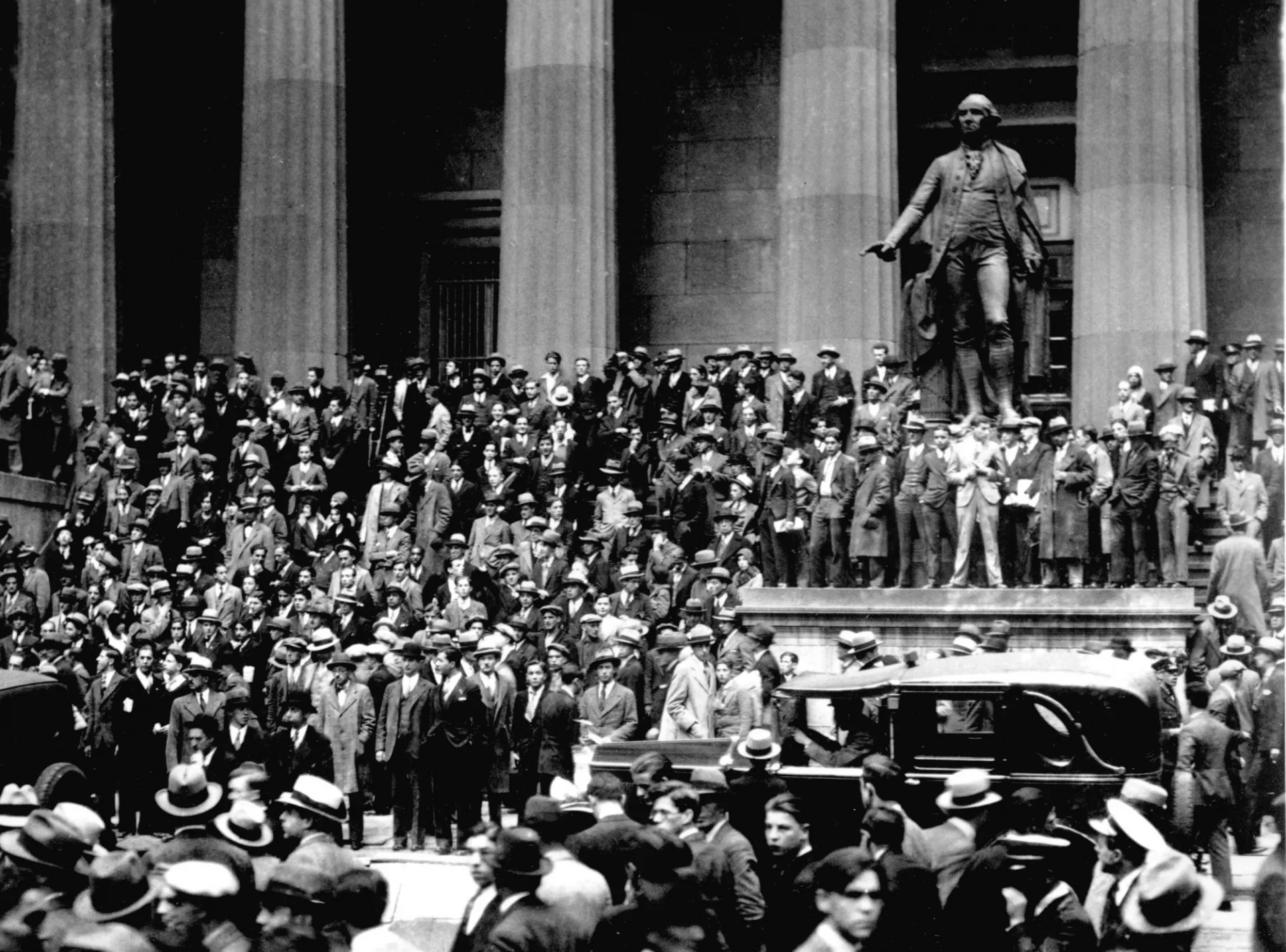 People gather on the sub-treasury building steps across from the New York Stock Exchange in New York on "Black Thursday," Oct. 24, 1929.