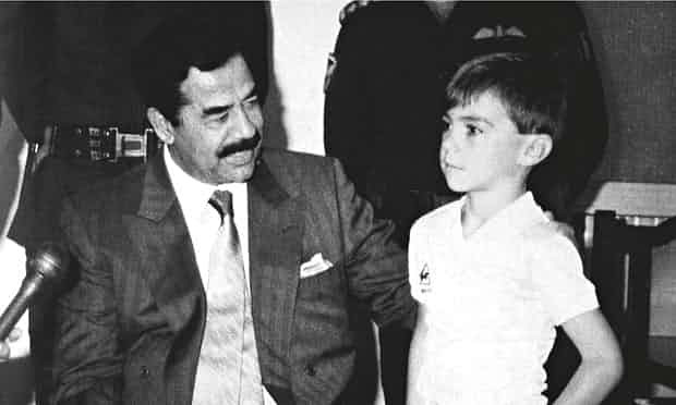 Saddam Hussein with five-year-old Stuart Lockwood, one of the hostages held as "human shields" by the dictator. Source: /Rex Features, on The Guardian: "That’s me in the picture: Stuart Lockwood with Saddam Hussein, 24 August 1990 Baghdad, Iraq" (5 Jun. 2015). Saddam Hussein with five-year-old Stuart Lockwood, one of the hostages held as "human shields" by the dictator. Source: /Rex Features, on The Guardian: "That’s me in the picture: Stuart Lockwood with Saddam Hussein, 24 August 1990 Baghdad, Iraq" (5 Jun. 2015).
