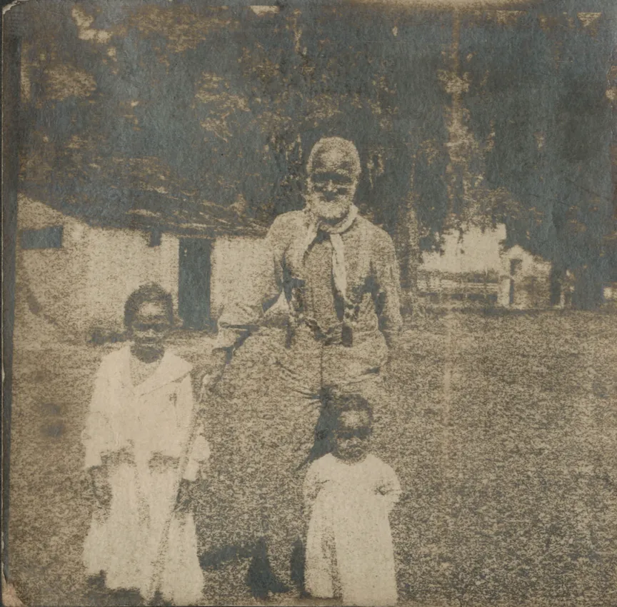 A photograph of Frank Campbell with his granddaughters (Mary Jane). Frank Campbell was one of the enslaved Africans sold in 1838 by the Corporation to pay Georgetown College’s debt. (Found in dissertation)