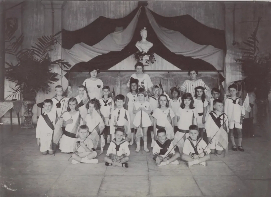 A Group of students from the Dutch Primary School in Singapore celebrating a royal holiday. 1924. Source: NNA. 2.24.05.02, 025 - 001.
