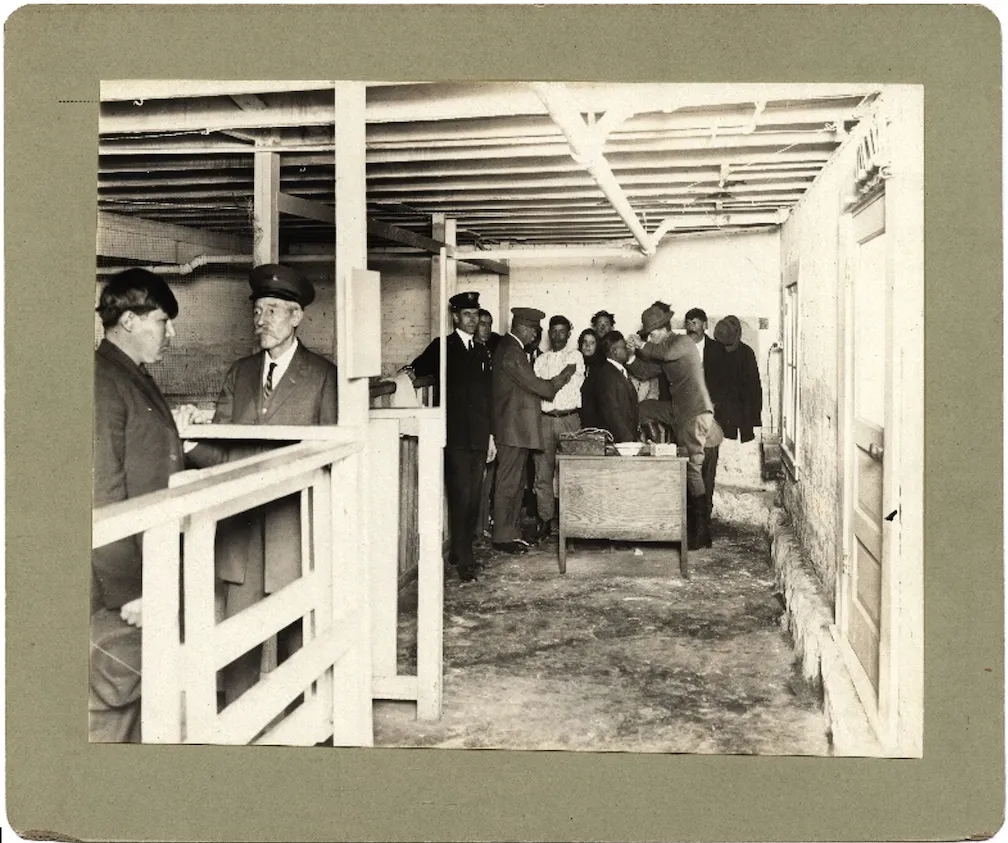 Image from National Archives and Records Administration. Captioned “Acting assistant surgeon Irving McNeil examining arriving aliens from Mexico” El Paso Quarantine, El Paso, Texas. Negative number 394. 90-G-161-1 (Found in dissertation)
