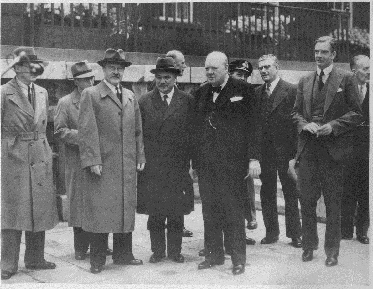 Soviet Minister for Foreign Affairs Vyacheslav Molotov with British Prime Minister Winston Churchill, British Foreign Secretary Sir Anthony Eden, and others during a visit to Britain in 1942. Source: Department of Foreign Affairs and Trade (Australia), on Wikimedia Commons. CC BY 3.0 au.