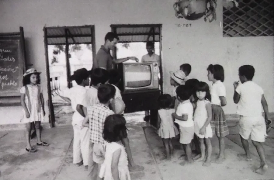 Peace Corps volunteer Dan Acuff installs a television receiver in the Escuela para Varones. El Espinal, Colombia, 1966. Source: National Archives and Record Administration, College Park, MD.