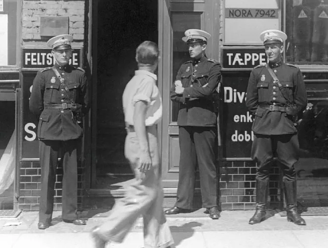 Police officers in front of Communist Party headquarters, Copenhagen 1941. Source: National Museum of Denmark. Flickr - No known copyright restrictions